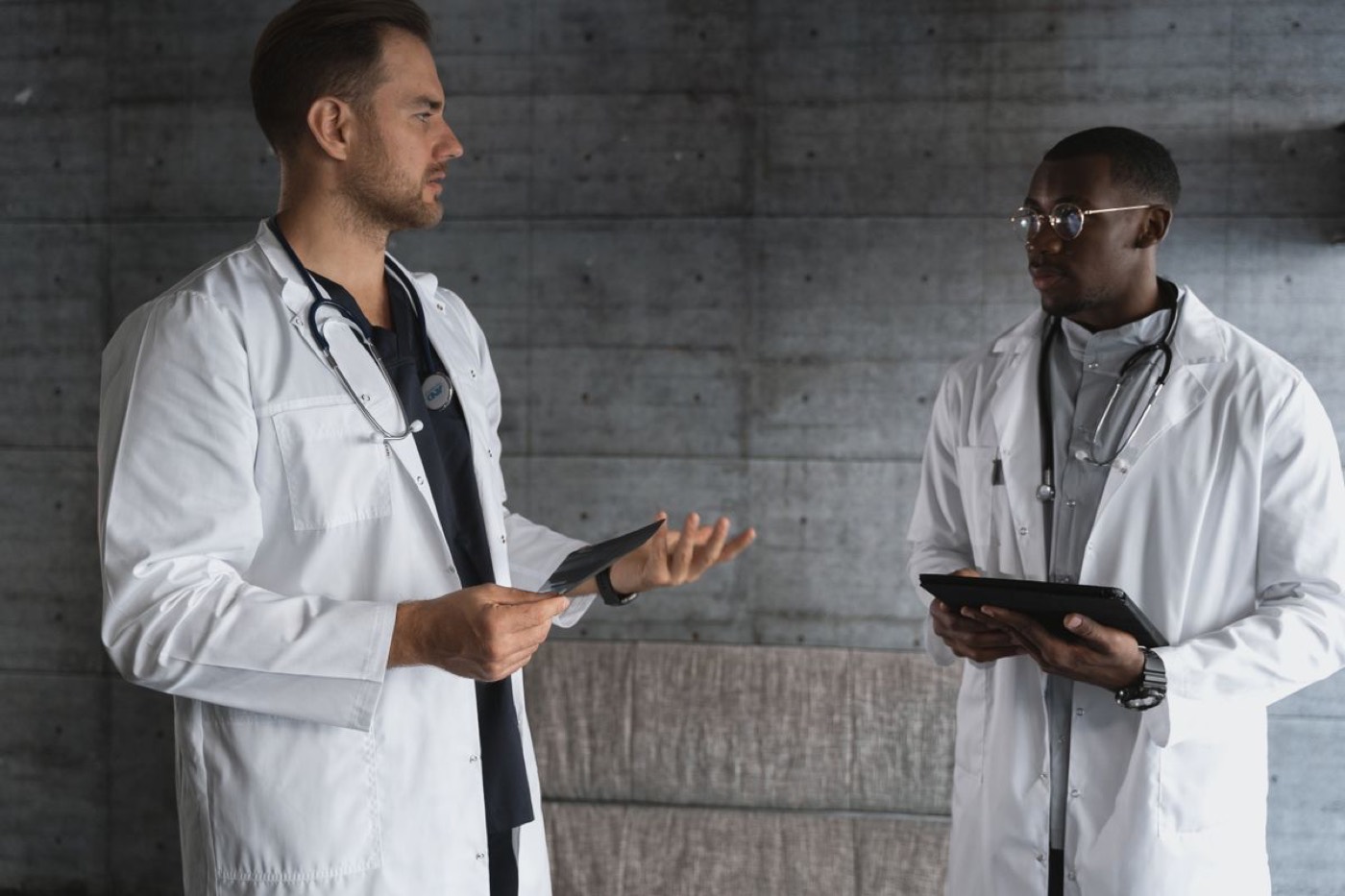 Two clinicians discussing a patient's treatment plan