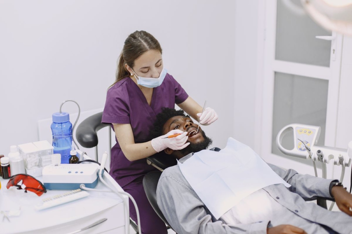 A patient having his gums examined during a periodontal appointment