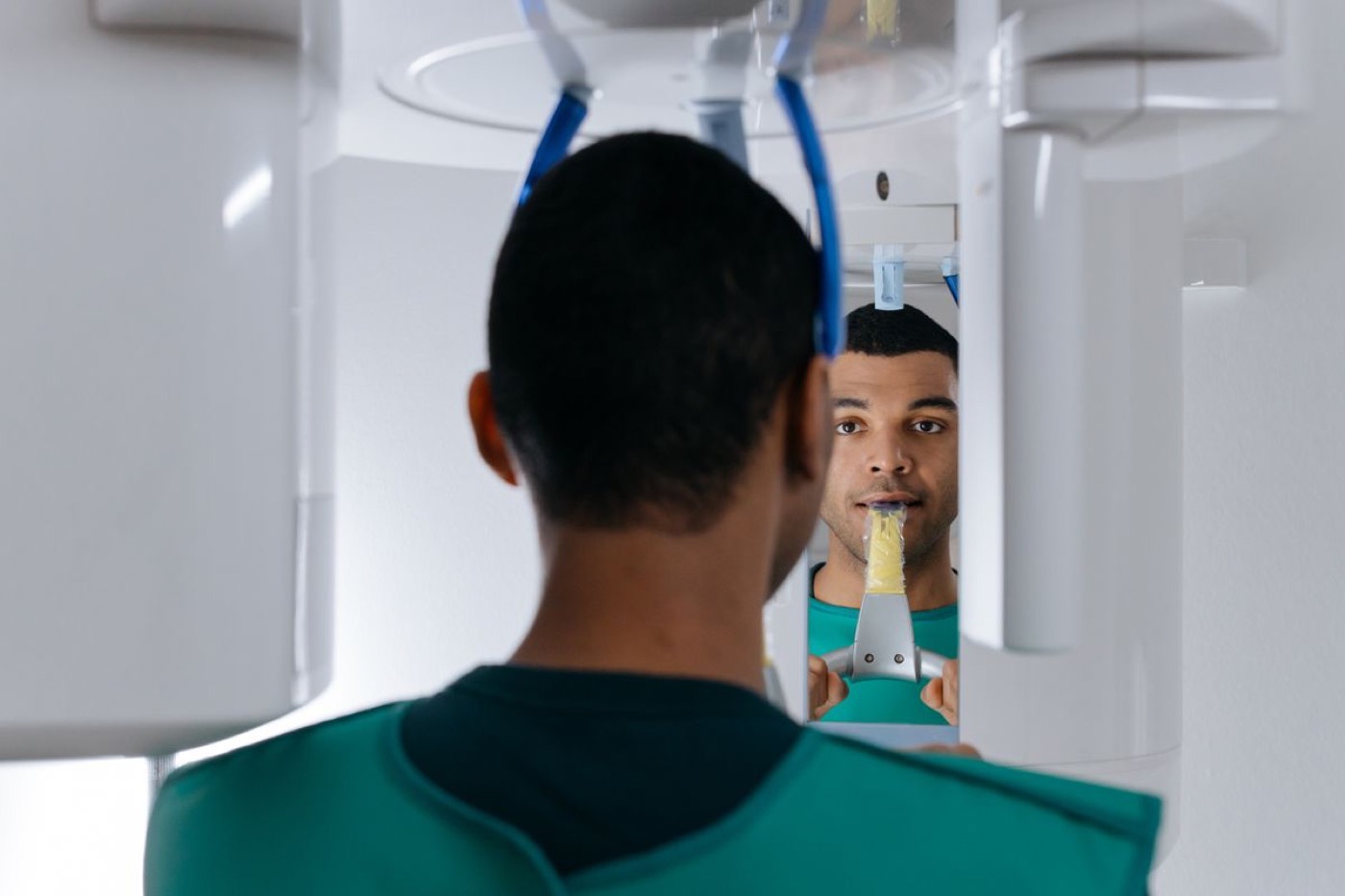 A patient having a panoramic and 3D scan taken